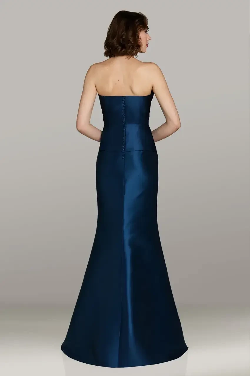 model is wearing a strapless blue evening gown