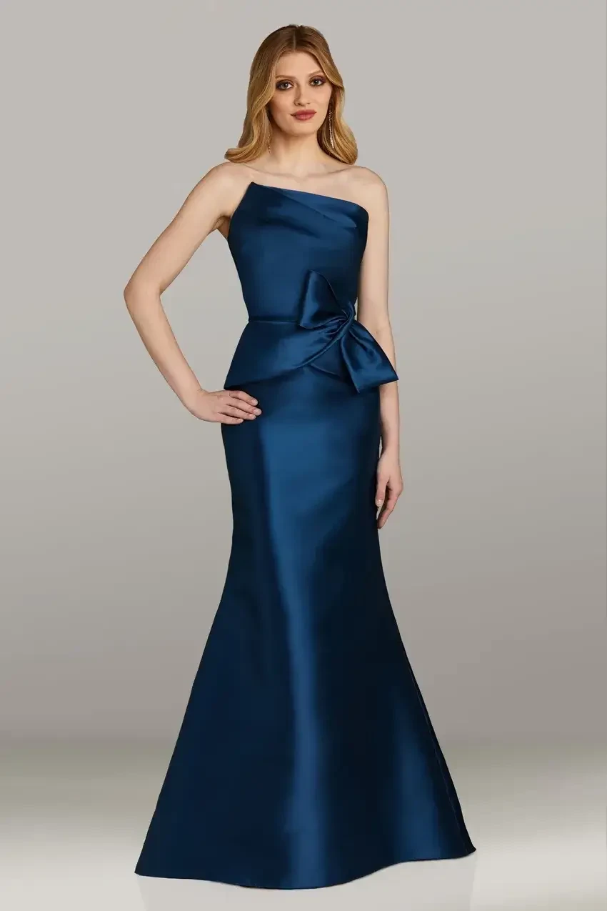 model is wearing a strapless blue evening gown
