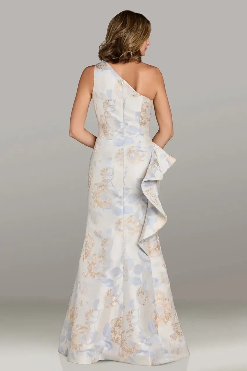 Model is wearing a one shoulder evening dress crafted with floral jacquard fabric and soft pastel florals by feriani couture