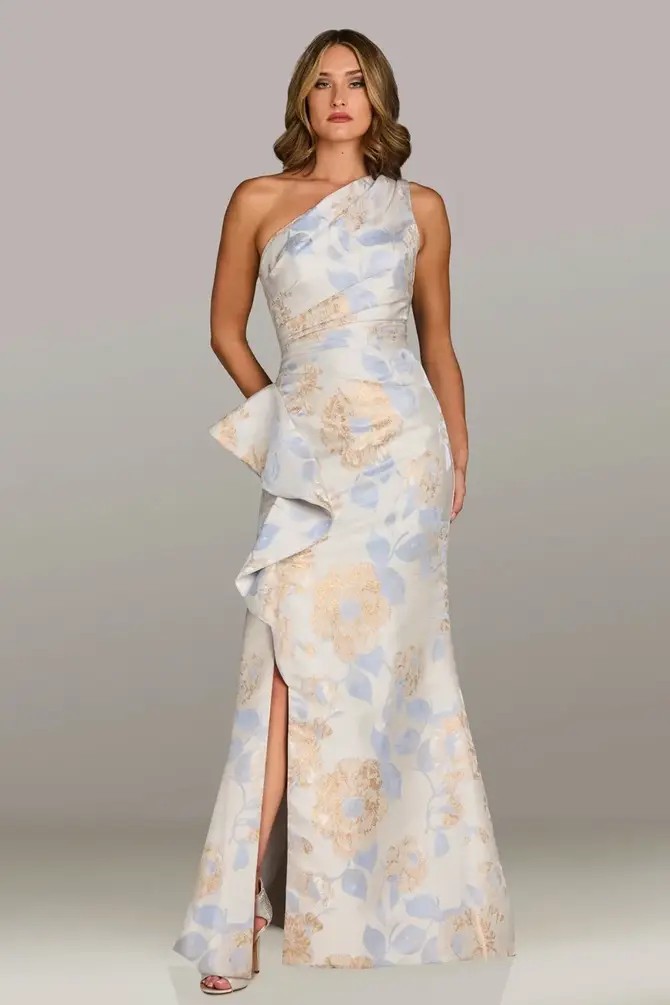 Model is wearing a one shoulder evening dress crafted with floral jacquard fabric and soft pastel florals by feriani couture