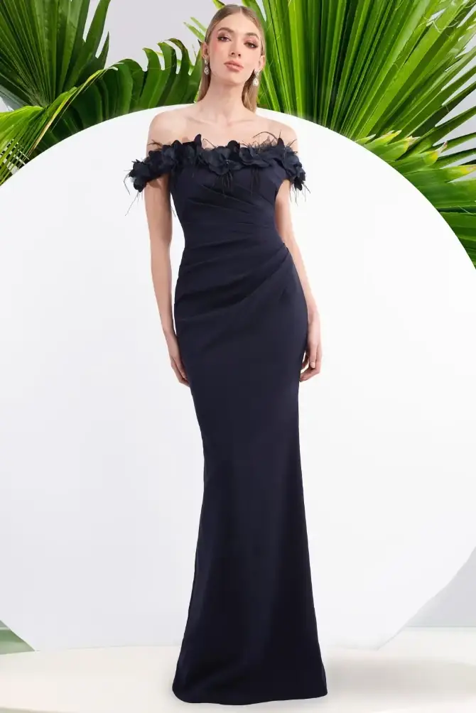 model is wearing an off the shoulder fit and flare evening gown
