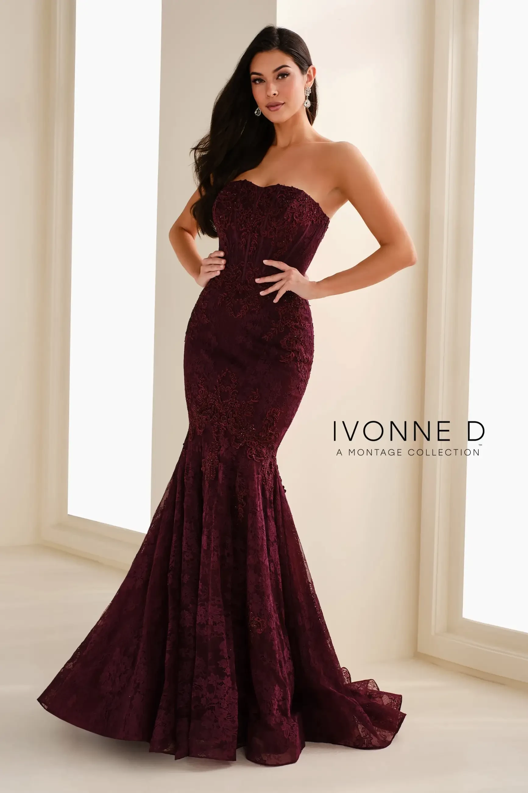 model is wearing an aubergine trumpet evening gown