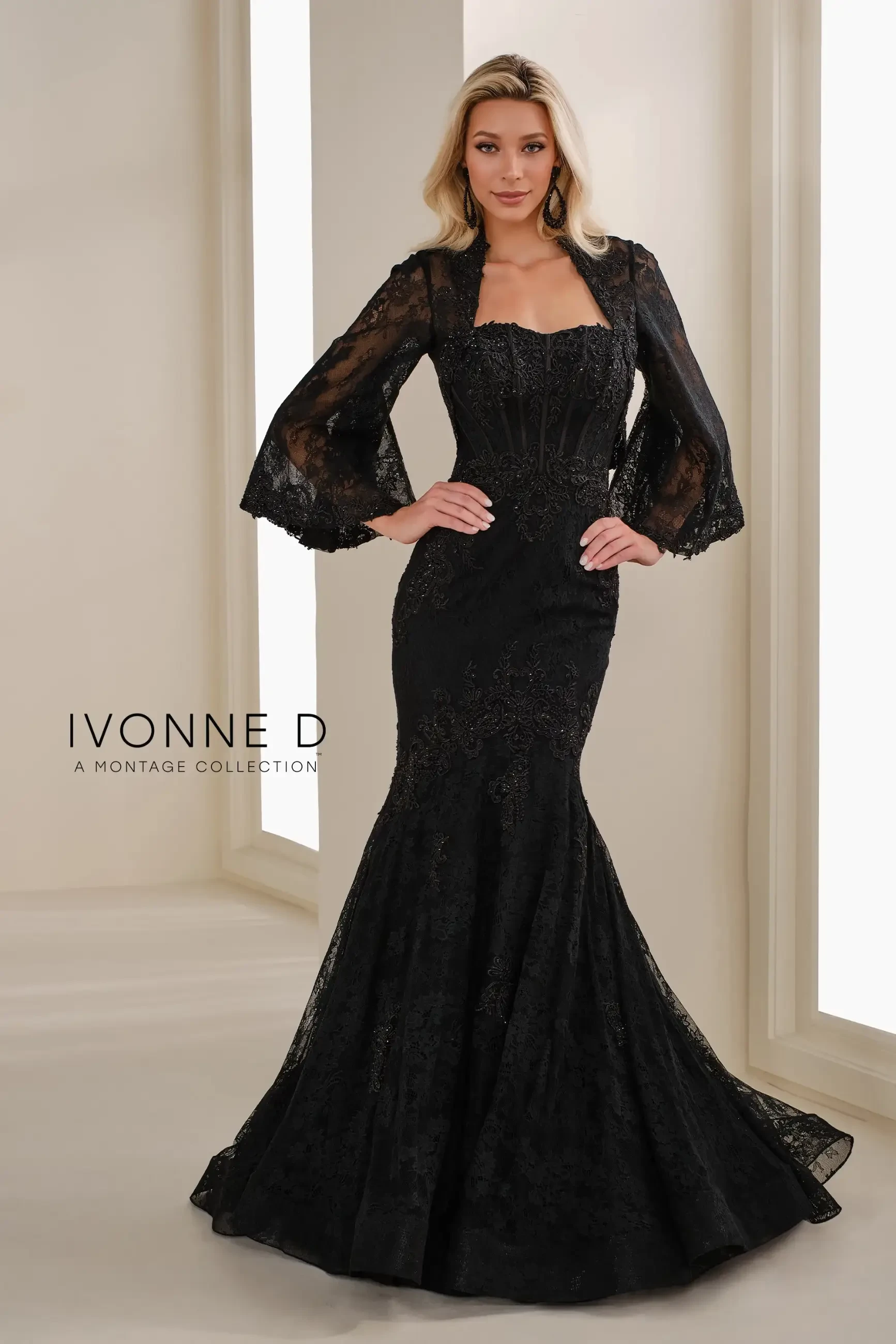 model is wearing a black strapless mothers dress with detachable puff sleeves