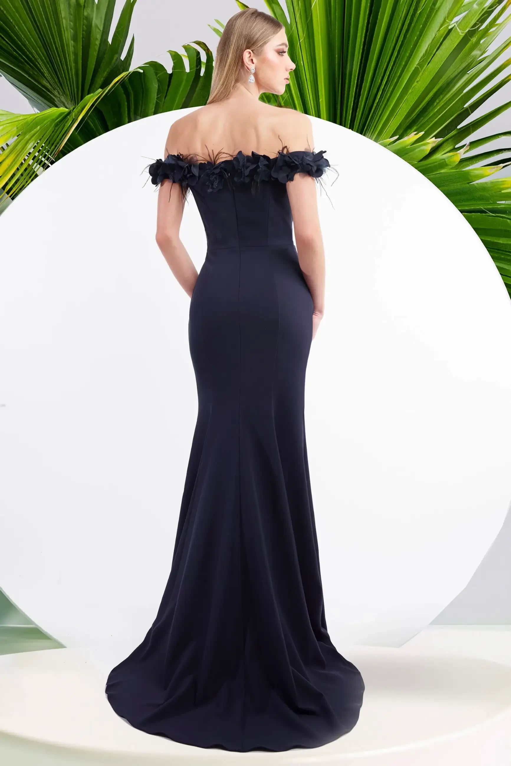 model is wearing an off the shoulder fit and flare evening gown